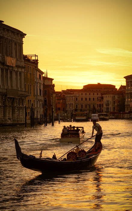 Gondola on the Grand Canal at sunset in Venice, Italy