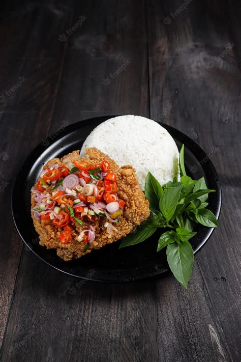 Premium Photo | Ayam Geprek sambal matah Popular street food dishes of ...