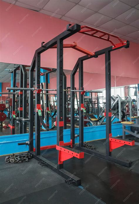 Premium Photo | Reinforced Squat Rack with safety ropes in gym