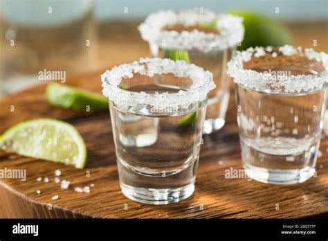 Alcoholic Tequila Shots with Lime and Salt Stock Photo - Alamy