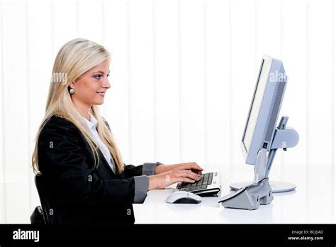 young woman with computer in office Stock Photo - Alamy