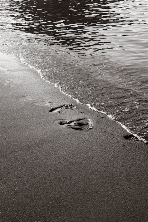 Footprints on a Beach Sand · Free Stock Photo