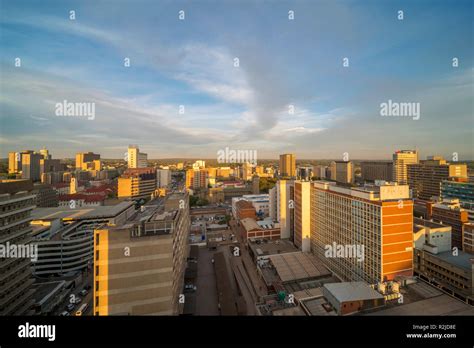 A sunset is seen over the Harare city skyline in Zimbabwe Stock Photo ...