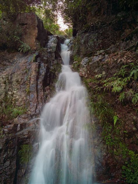Small Waterfall through Some Rocks Stock Image - Image of rocks, waterfall: 93520527