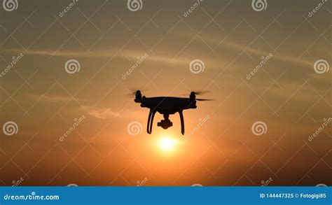 Drone Silhouette Against The Background Of The Sunset Stock Image - Image of outdoors ...