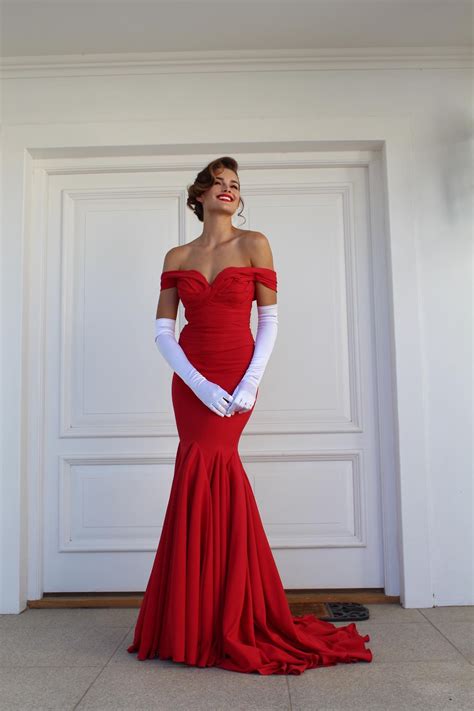 Miss World and Miss South Africa Rolene Strauss in a red evening gown ...