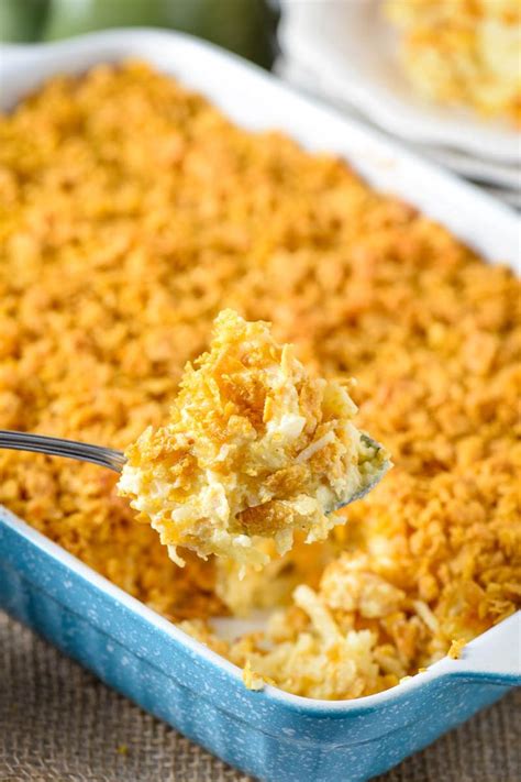 Make ahead a cheesy hash brown casserole recipe, filled with shredded potatoes and topped wi ...