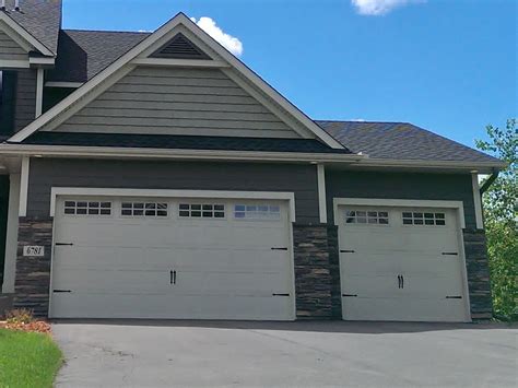 New home construction - 3 car garage, roof gable, vinyl siding, vinyl ...