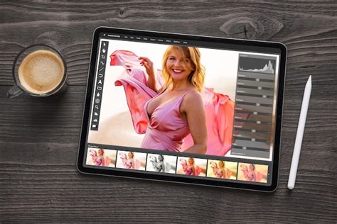 Premium Photo | Tablet on table with photo editing app on screen