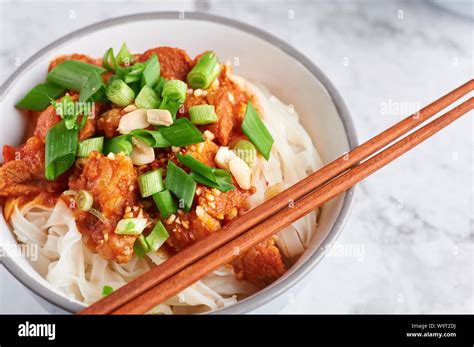 shan noodles with chopsticks at white marble tabletop. burmese cuisine traditional dish. myanmar ...