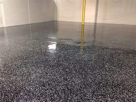 1/4" Salt and Pepper (Black and White) on black epoxy floor finished with a clear polyurethane ...