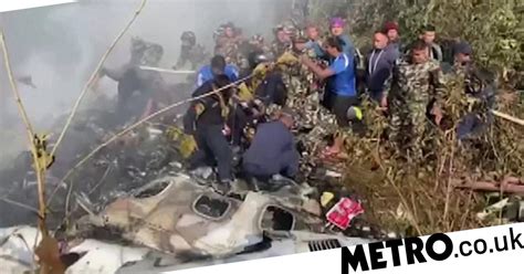 Watch: Rescue workers search for survivors in smouldering wreckage of ...