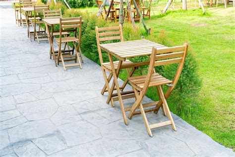 wood table and chair in outdoor coffee shop cafe and restaurant 14631347 Stock Photo at Vecteezy