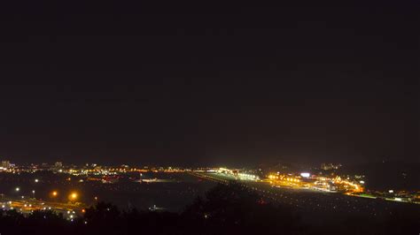 Night footage of aviation traffic at the airport. Landing lights ...