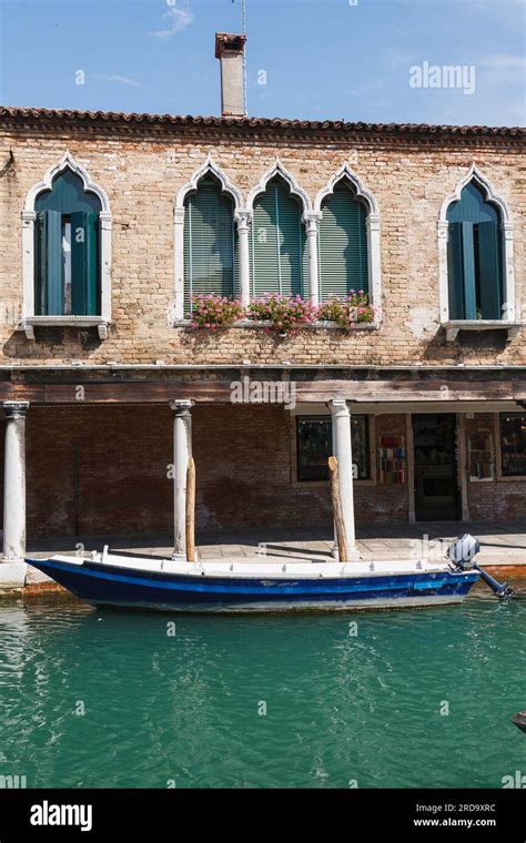 Boat outside Venice house Stock Photo - Alamy