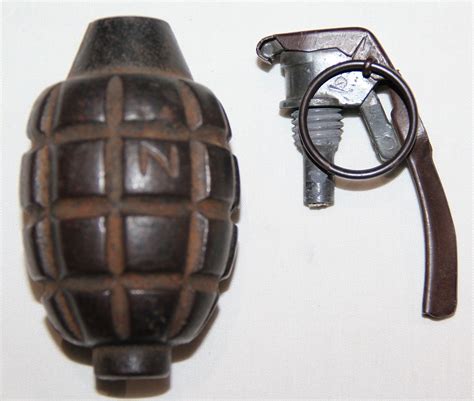 B026. INERT WWI MK1 DEFENSIVE GRENADE W/ EARLY BOUCHON - B & B Militaria