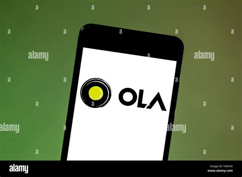 In this photo illustration the Ola Cabs logo is seen displayed on a smartphone Stock Photo - Alamy