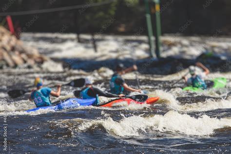 Kayak slalom canoe race in white water rapid river, process of kayaking ...