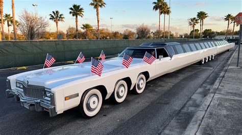 World's longest car has 26 wheels, putting green, helipad and swimming ...