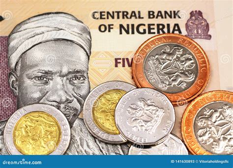 A Close Up Image of Assorted Nigerian Coins on a Five Nigerian Naira ...