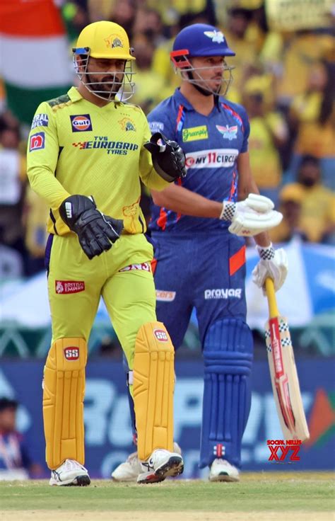 Lucknow : - CSK's captain MS Dhoni and LSG's Marcus Stoinis during the ...