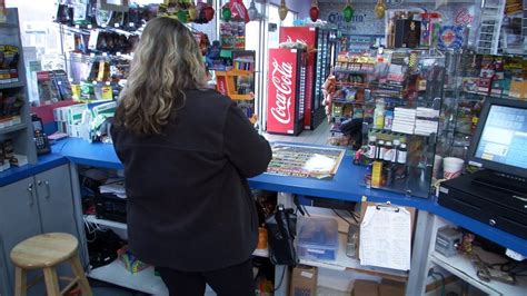 The cashier at the gas station saw a woman hurrying out of the restroom.