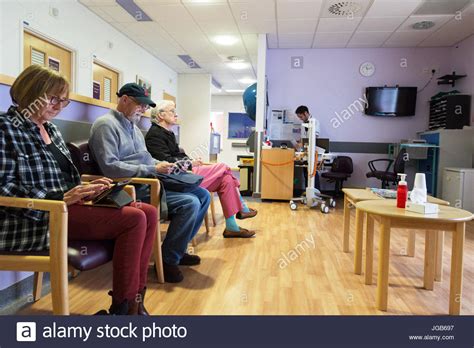 NHS Hospital patients waiting in an outpatient clinic hospital Stock Photo: 147763875 - Alamy