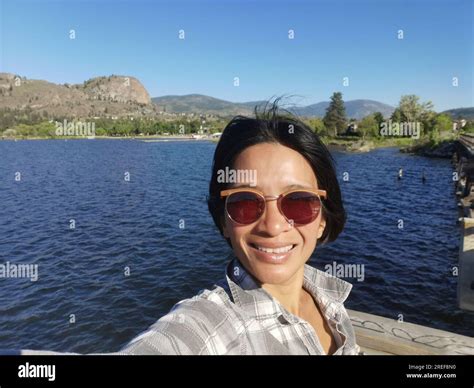 Woman taking selfie from Okanagan Falls KVR Trestle Bridge with ...