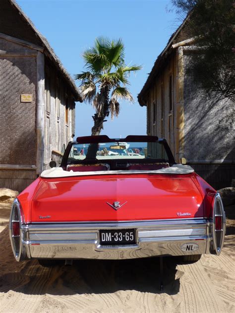 Free Images : beach, sea, sand, red, palm, auto, sports car, motor vehicle, vintage car, sedan ...