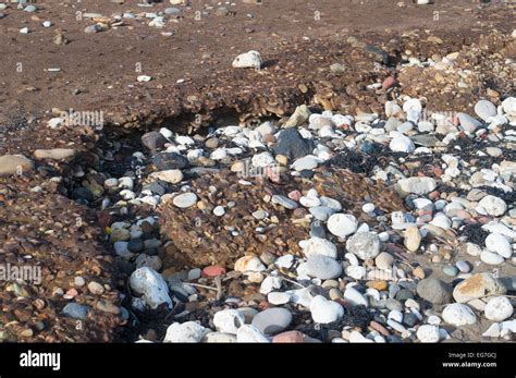 Blackhall Colliery beach showing eroded layer of coal mining waste ...