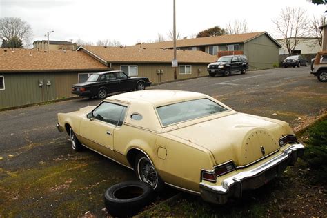 OLD PARKED CARS.: 1974 Lincoln Continental Mark IV.