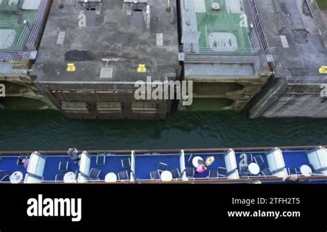 Panama Canal, Panama - cruise ship sailing into Aqua Clara Locks past the two rolling gates. The ...