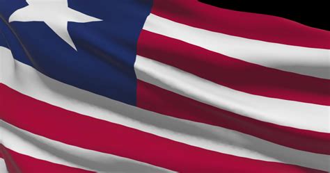 Liberia flag waving closeup, national symbol of country background ...