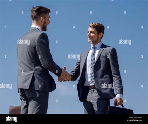 business people greet each other with a handshake Stock Photo - Alamy