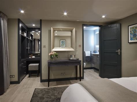 Luxurious en-suite with custom storage and mini-bar