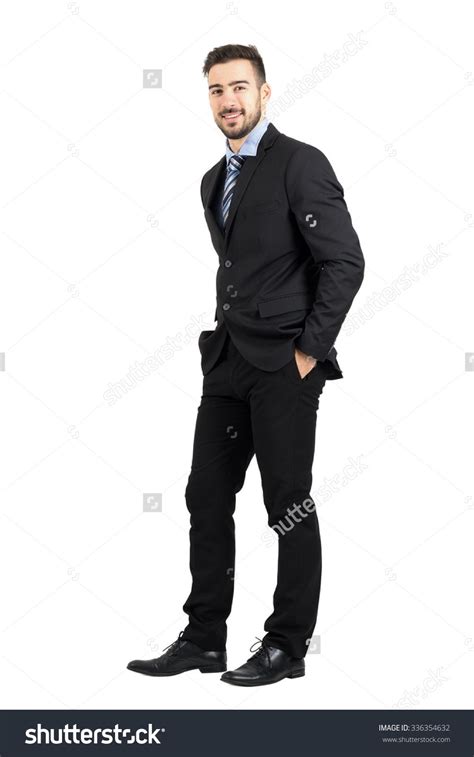 Confident happy business man with hands in pocket side view. Full body length portrait isolated ...