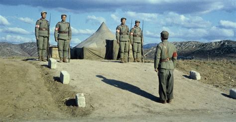 guards-in-front-of-korean-peace-conference-tent - Korean War Pictures - Korean War - HISTORY.com