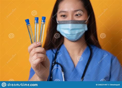 Selective Focus on Sample Tubes in the Hands of an Asian Female Doctor with Mask Stock Image ...