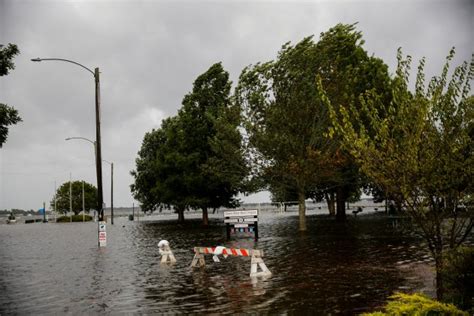 Wind, flooded roads herald approach of Hurricane Florence in North Carolina