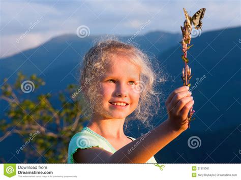 Girl and Butterfly in Sunset Mountain Stock Image - Image of nature, cute: 21375361