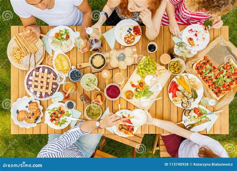 Group of Friends Sharing Food Stock Photo - Image of angle, fresh: 113740928