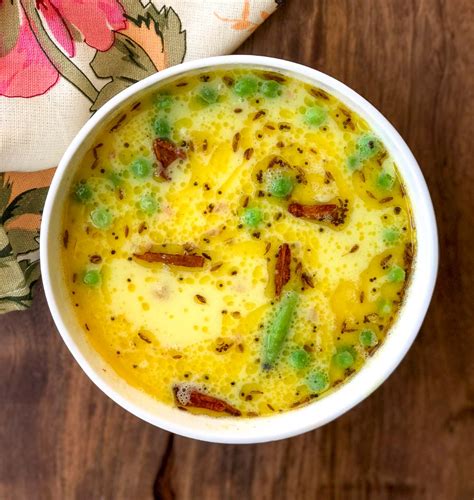 Gujarati Kadhi is a yogurt based sweet and spicy curry that is simple yet irresistible; it gets ...