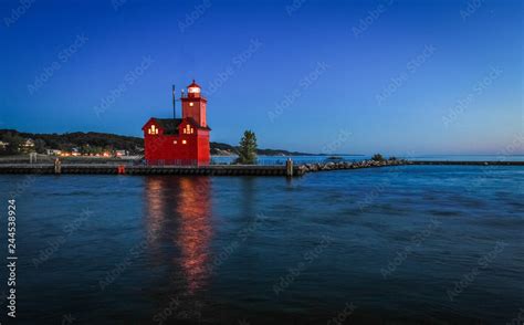 Holland Michigan Lighthouse At Night. The beautiful big red lighthouse at Holland State Park at ...