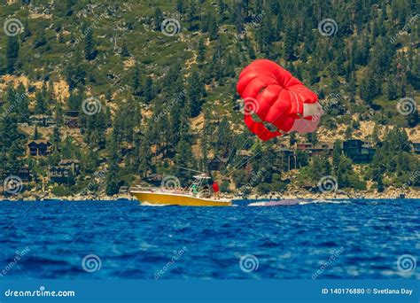 Red Parasail Wing Pulled by a Boat on Lake Tahoe in California, USA Stock Photo - Image of ...