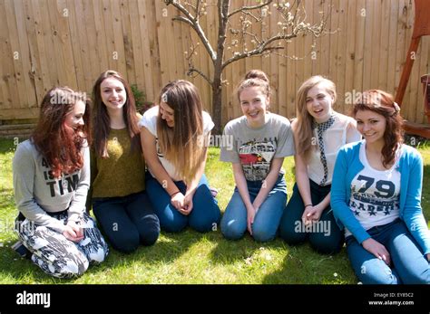 Happy group of teenage girls laughing Stock Photo - Alamy