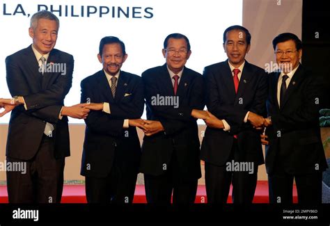 From left, Singapore Prime Minister Lee Hsien Loong, Brunei Sultan Hassanal Bolkiah, Cambodia ...