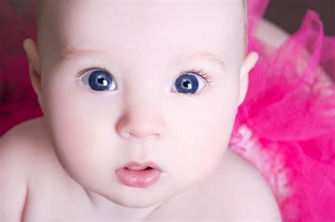 Premium Photo | Close up portrait of funny baby girl with big eyes