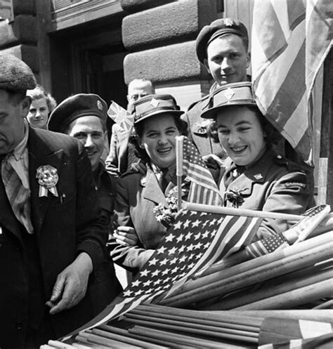 Canadian soldiers and CWAC members buying flags to wave in… | Flickr