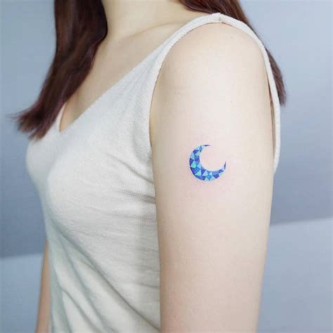 Colorful crescent moon tattoo on the arm - Tattoogrid.net