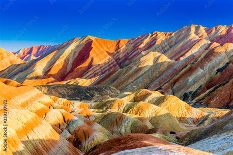 Amazing scenery of Rainbow mountain and blue sky background in sunset ...